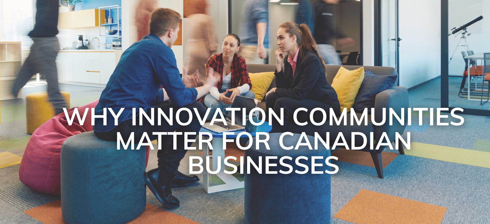 A group of innovators discuss ideas at an innovation community hub.